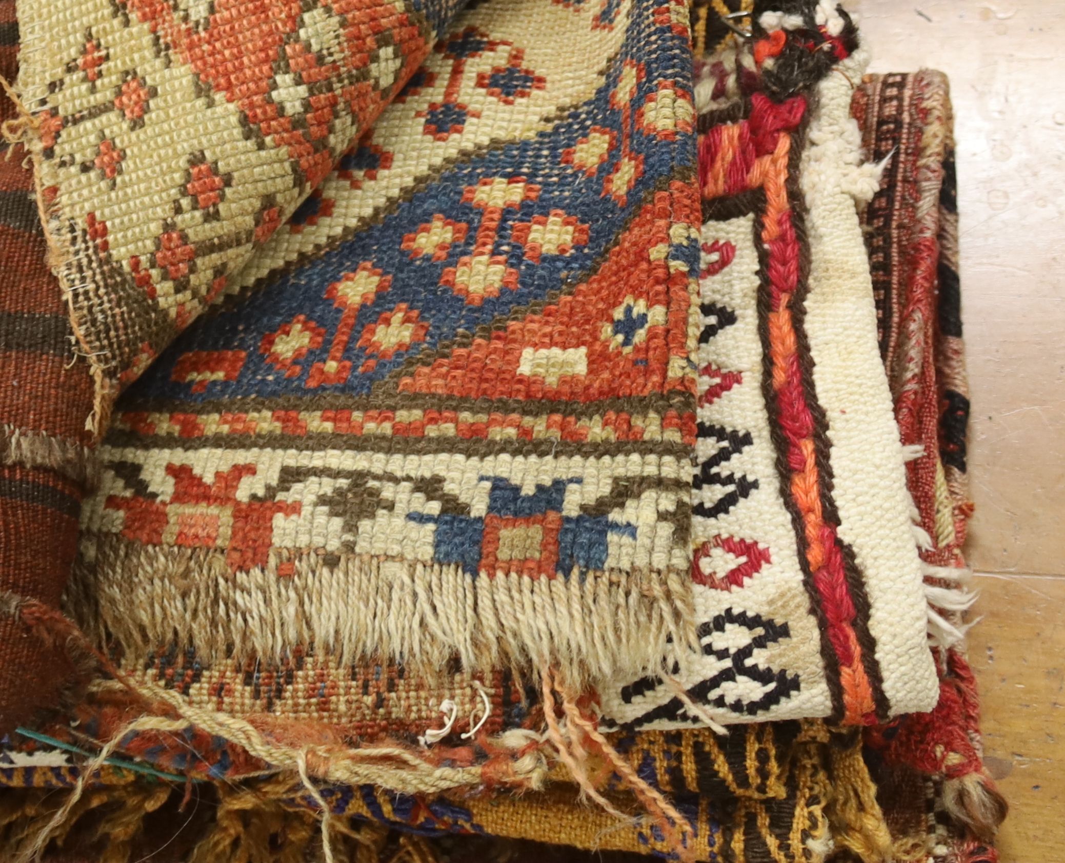 Seven Middle Eastern rugs/saddle bags